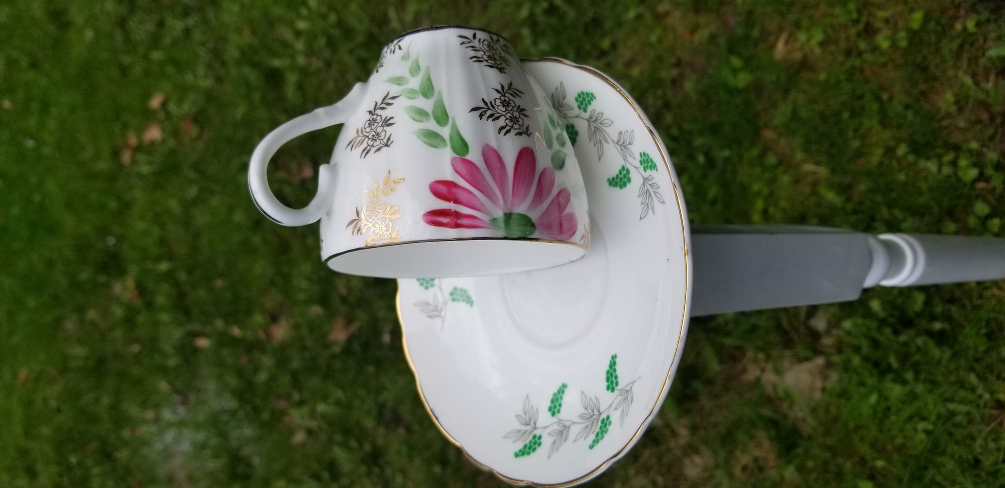 Teacup bird feeder on post