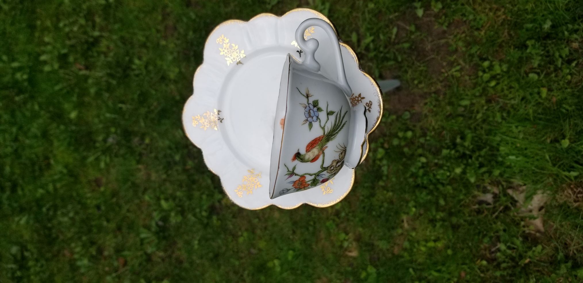Floral teacup feeder on post